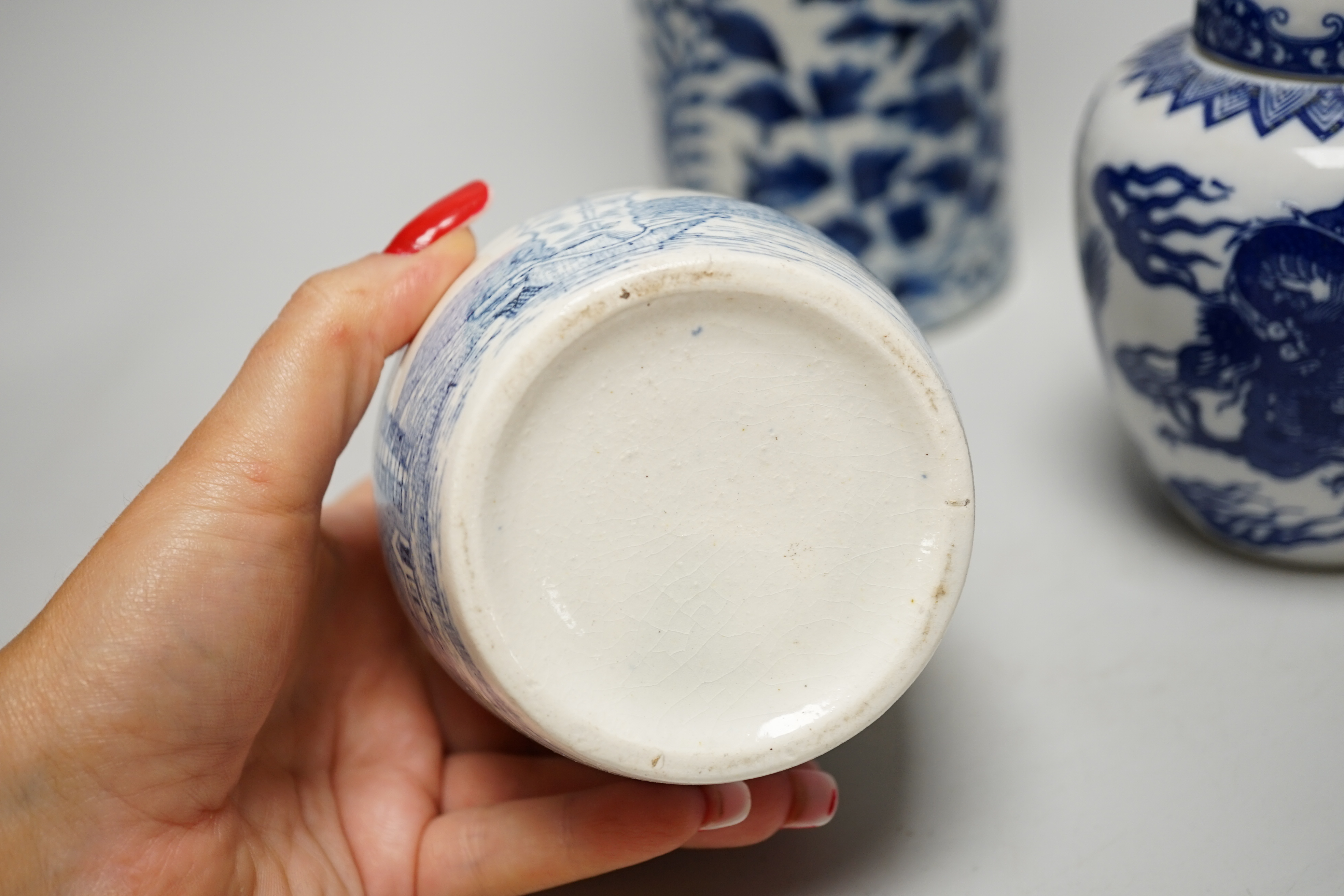 An early 20th century Chinese vase together with two small jars with covers, highest 31cm